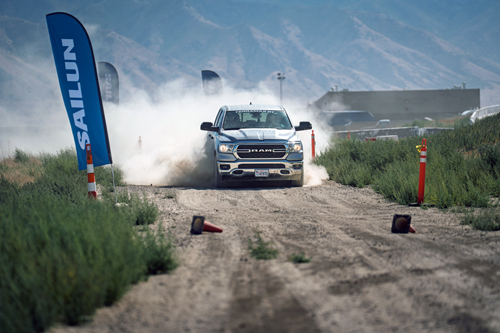 A Sailun test event in Utah: a Mustang GT with Atrezzo SVA2 tires on the track, a Ram truck mounting TerraMax AT2 over a Baja-style course, and a Jeep Rubicon equipped with Terramax RT climbing a test trail.